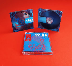 Clear MiniDiscs with a white base only under the metal clip area, creating a custom transparent blue MiniDisc