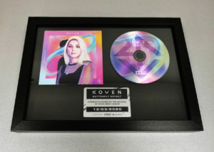 Black A4 frame with printed metal plaque, CD and booklet