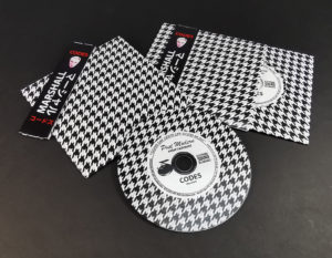 Premium vinyl CDs in printed outer and record-style inner wallets with Obi strip