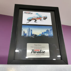 Burnout Paradise development team award frames with custom printed backgrounds and plaques