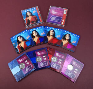 Clear transparent MiniDiscs, printed with light blue, dark blue, red and pink tints and full colour artwork