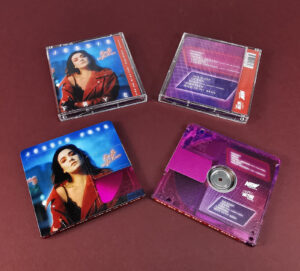 Clear transparent MiniDiscs, printed with a pink tint and full colour artwork