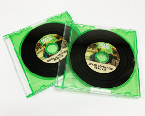 Mini 8cm vinyl-effect CDs with full colour sticker printing and packed in green frosted jewel cases