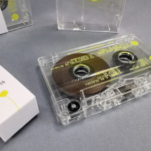 Clear prison cassette tapes with single side on-body printing, spot gloss and on-body printed clear plastic cases, plus obi strips