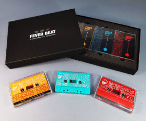 Triple cassette tape box set of tangerine orange, turquoise and red tapes and black A5 presentation boxes