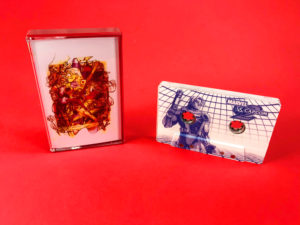 Clear cassette tapes with full coverage on-body printing, in transparent red back tape cases with J-cards