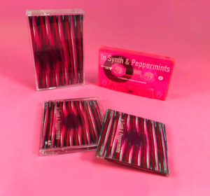 Transparent pink cassette tapes with white on-body printing and MiniDiscs with full coverage on-body printing
