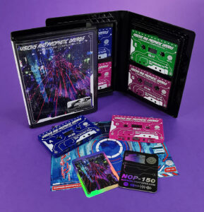 Quad tape black rave case with four tapes, all with on-body white printing and inserts that include holographic trading cards