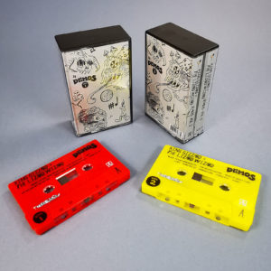 Double cassette set yellow and red tapes in double butterfly cases with a black spine