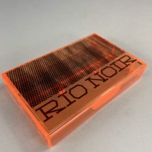 Transparent orange cassette tape case with black on-body printing