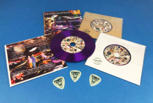 Purple vinyl CDs in two page premium vinyl CD wallets with glow in the dark guitar picks