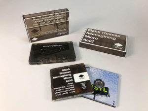 Clear brown smokey cassettes and cases with white on body printing, and clear MiniDiscs with full colour front and back print
