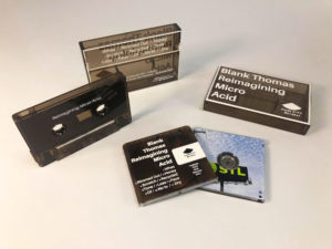Clear brown smokey cassettes and cases with white on body printing, and clear MiniDiscs with full colour front and back print