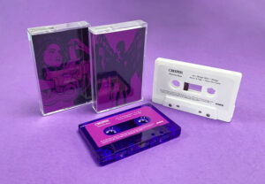 White and transparent purple cassette shells with sticker printing in clear cases with full colour J-cards