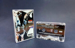 Transparent cassette shells with a white on-body print in clear cases with full colour 6 panel J-cards