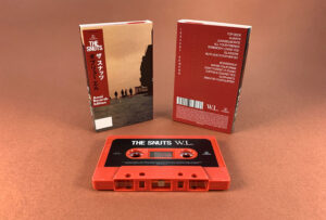 Brick red cassette shells with sticker printing in full colour printed O-cards