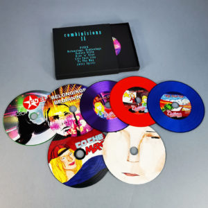 A seven CD matchbox set with turquoise foil printing on the matchbox and seven custom printed vinyl-style CDs in plain black record-style wallets