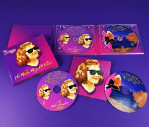 6 page digipak with two disc trays and booklet pocket with poster booklet, plus 4/4 printing and gloss lamination