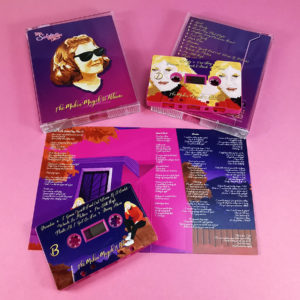 Double hot pink cassette tape sets in double stacked cases with full coverage on-body printing