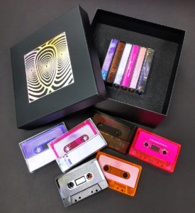 Six cassette tape box set with foil lid and base print and custom foam insert to hold cassette tapes