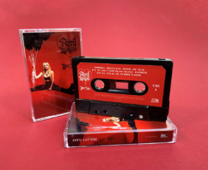 Black, red, orange and transparent orange cassette shells with sticker printing in clear cases with full colour J-cards