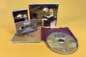 A matching set of brown cassettes with full colour on-body print and CDs in custom burgundy jewel cases