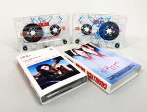 Clear prison cassette shells with red and blue colour on-body print in O-cards