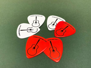 Red and white printed Guitar picks