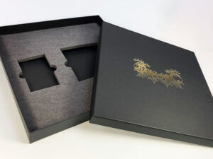 Cassette tape and CD box set with gold foil print lid and custom foam insert