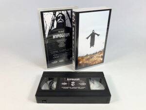 Sticker printed VHS tapes in clear cases with outer cover insert