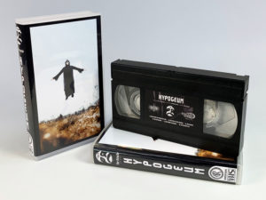 Sticker printed VHS tapes in clear cases with outer cover insert