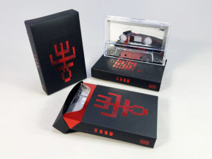 Silver mirror cassette tapes in black card cigarette pack cases with red hot foil printing and red metallic liners