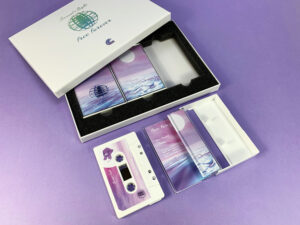 Three cassette tape box set with holographic foil print lid, custom foam insert, and white cassettes in tape cases with on-body full transparent printing for stunning effect