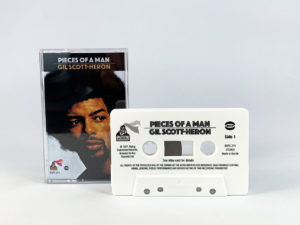 White cassette shells with black on-body print in clear cases with full colour 3 panel J-cards