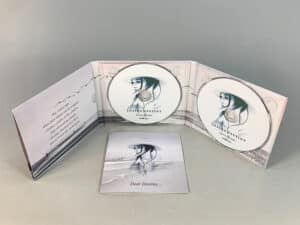 6 page digipak with 2 disc trays and booklets in outter left pockets