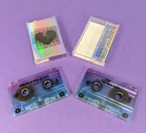 Cassette tapes with J-cards printed on holographic board