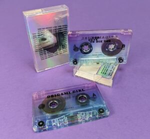 Cassette tapes with J-cards printed on holographic board