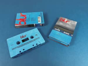 Recycled blue cassette shells with on body printing in full colour printed O-cards