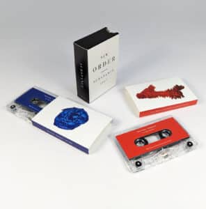 Double clear cassette tapes in O-cards with a custom double O-card slipcase
