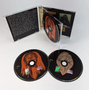 Double black base silk screen printed discs in standard depth double CD cases with CD posters