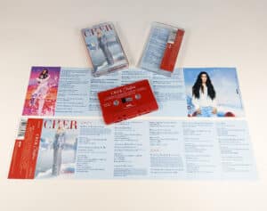 Solid red cassette tapes with white on-body printing in cases with J-cards